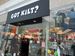 The “Got Kilt?” storefront in the Mall of America in Minneapolis. A cardboard standup of a kilt-wearing man greets you at the entrance. Through the glass, you can see some Funkopops, several items of clothing, and a few plushies.